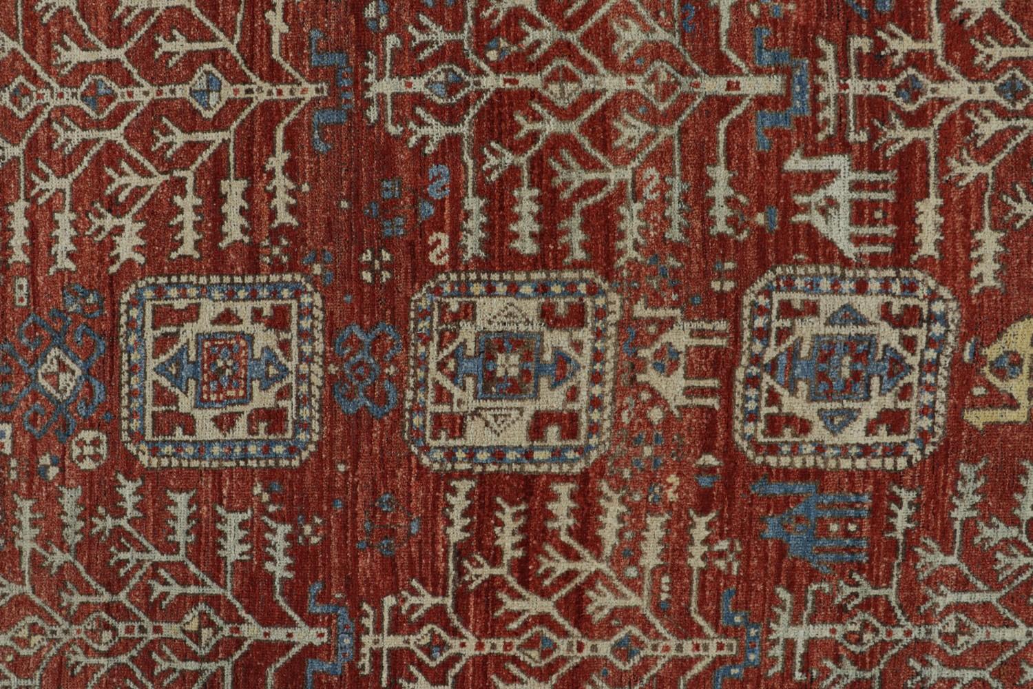 Red Tribal Rug with Camel Motifs
