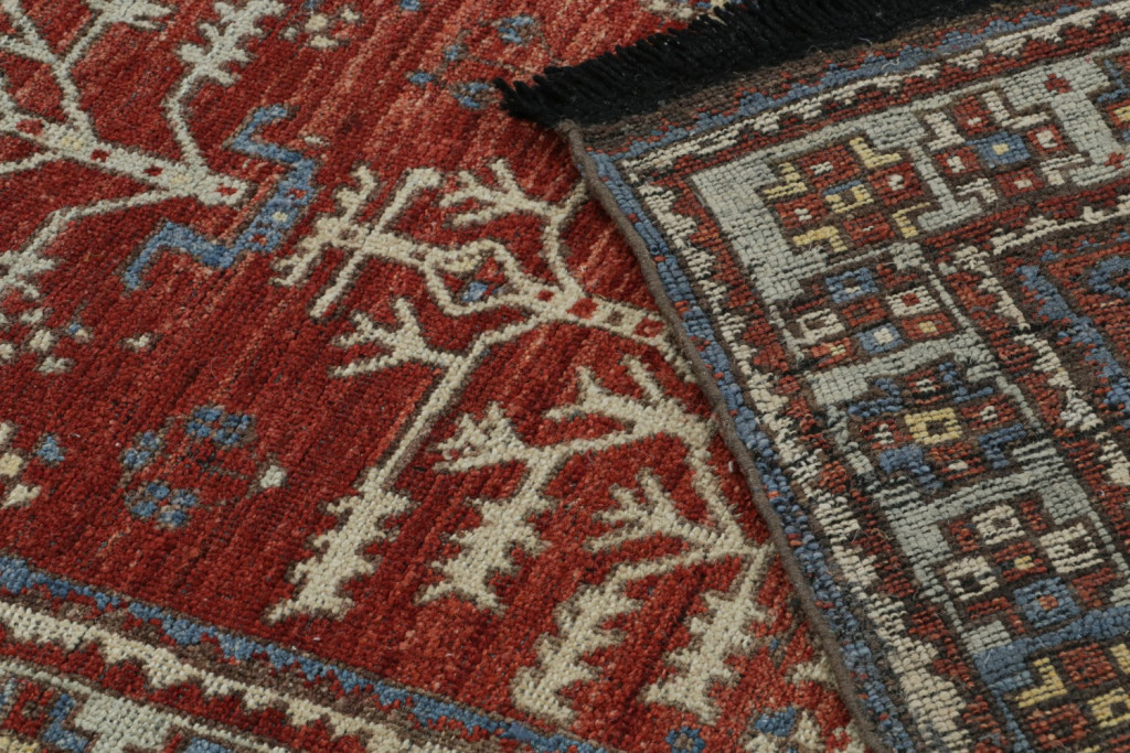 Red Tribal Rug with Camel Motifs
