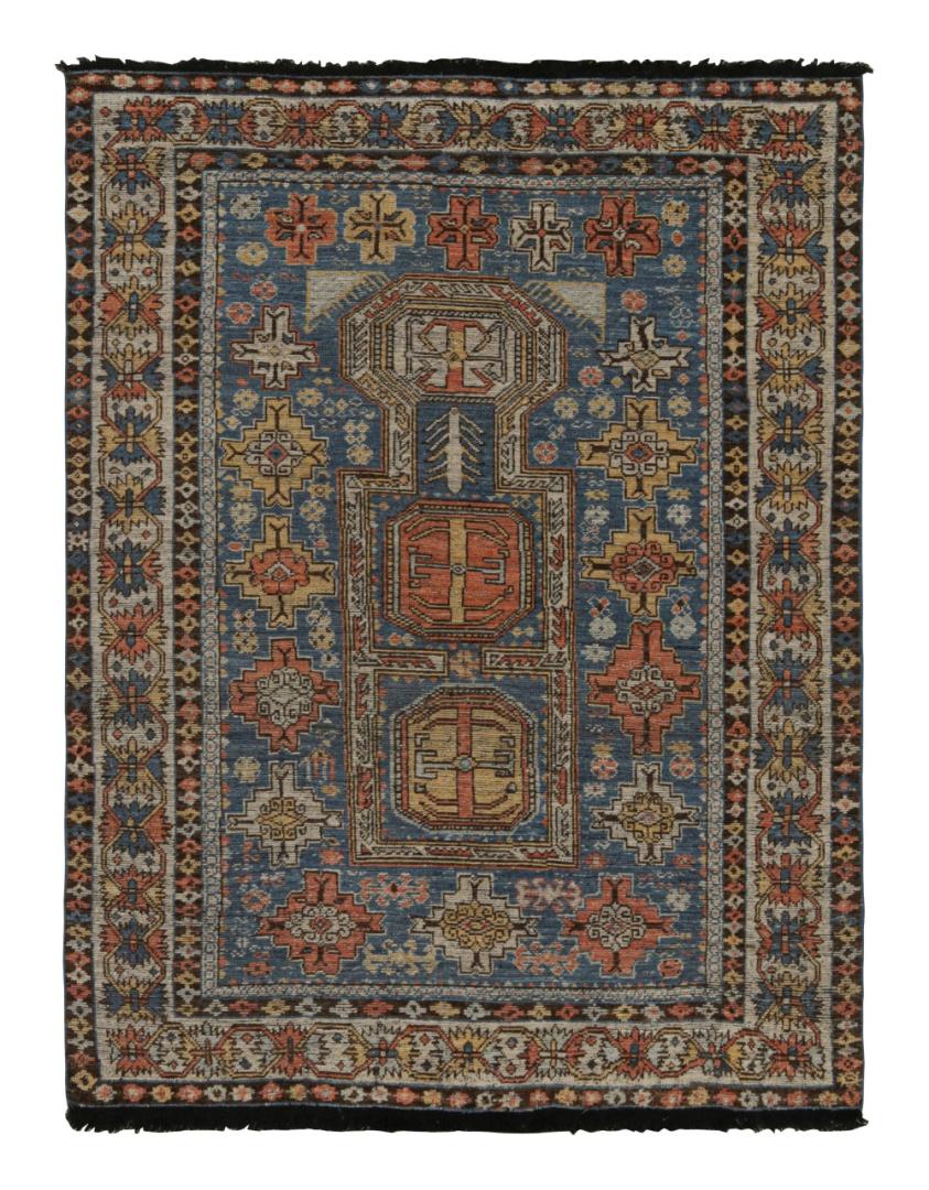 Blue Tribal Rug with Geometric Patterns