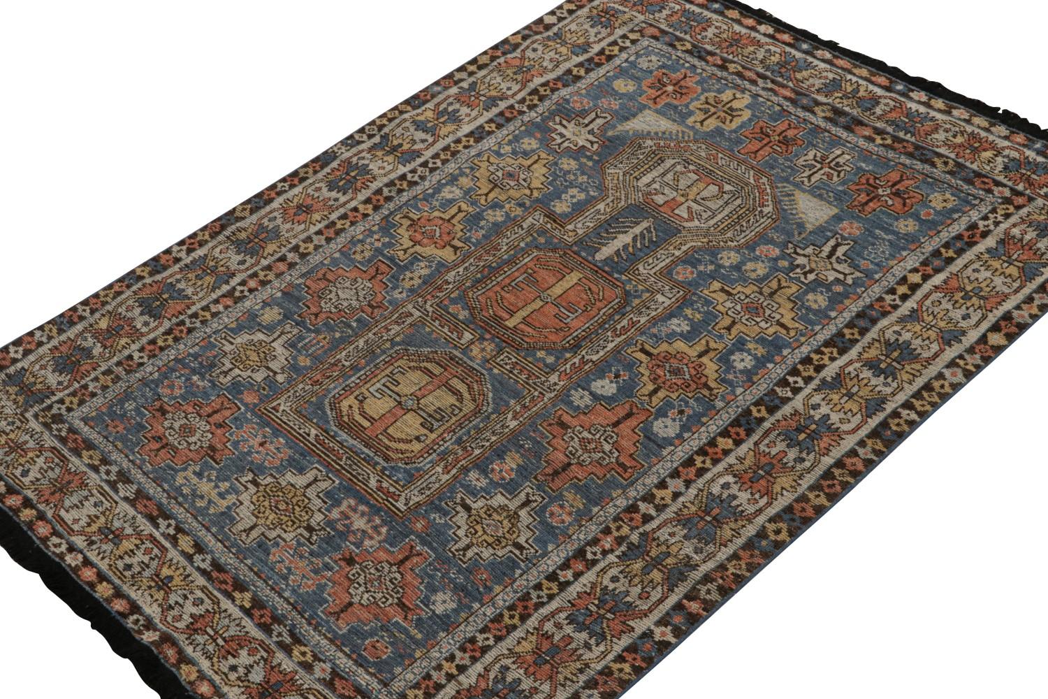 Blue Tribal Rug with Geometric Patterns