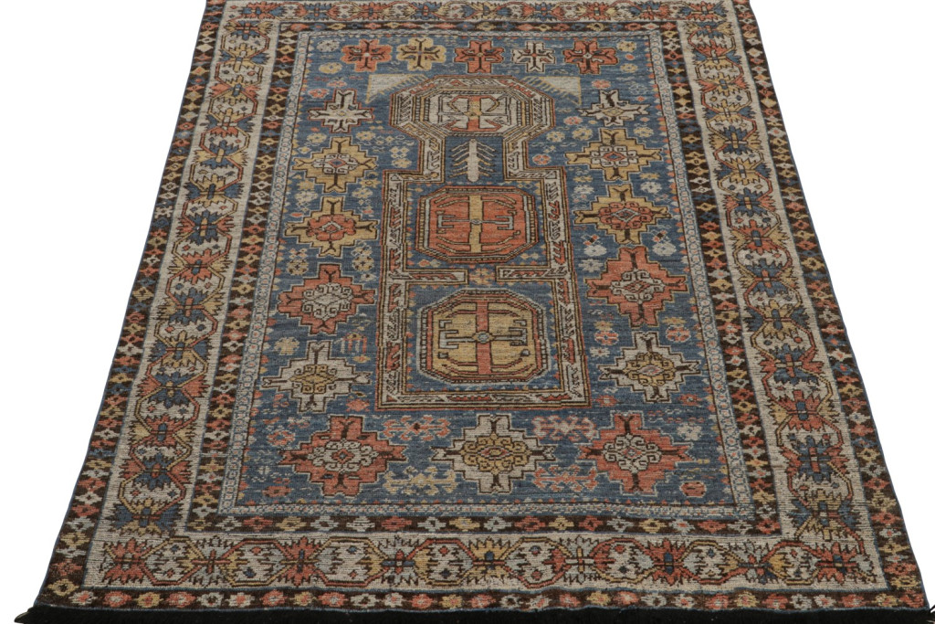 Blue Tribal Rug with Geometric Patterns