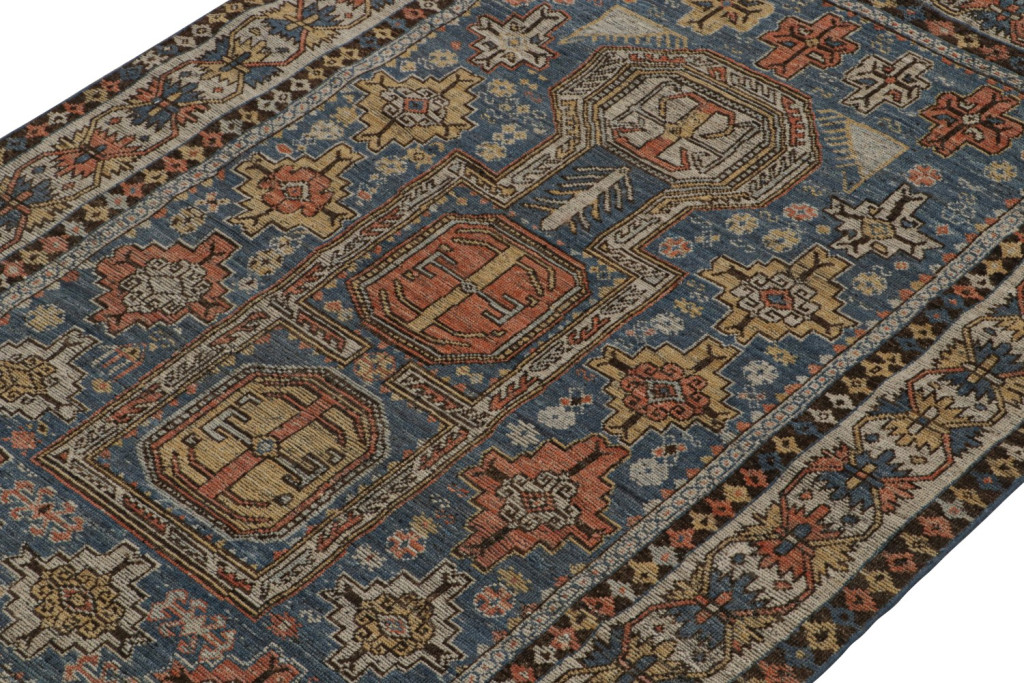 Blue Tribal Rug with Geometric Patterns