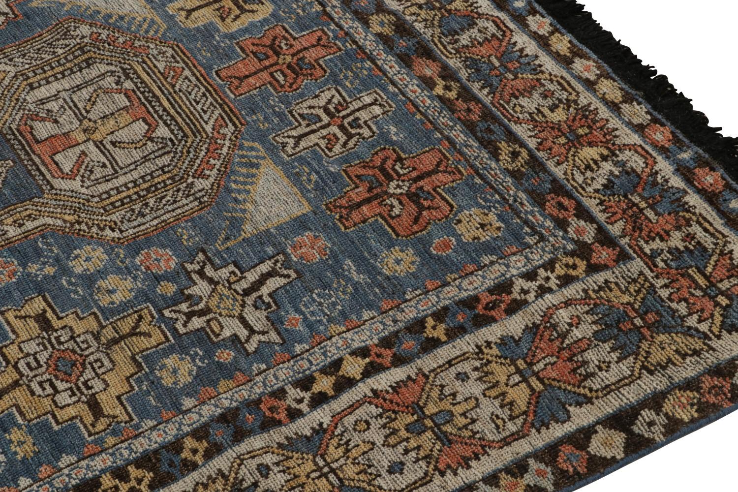 Blue Tribal Rug with Geometric Patterns