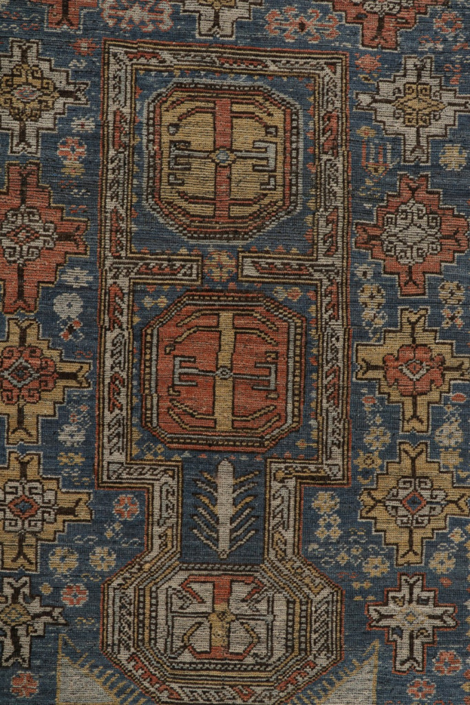 Blue Tribal Rug with Geometric Patterns