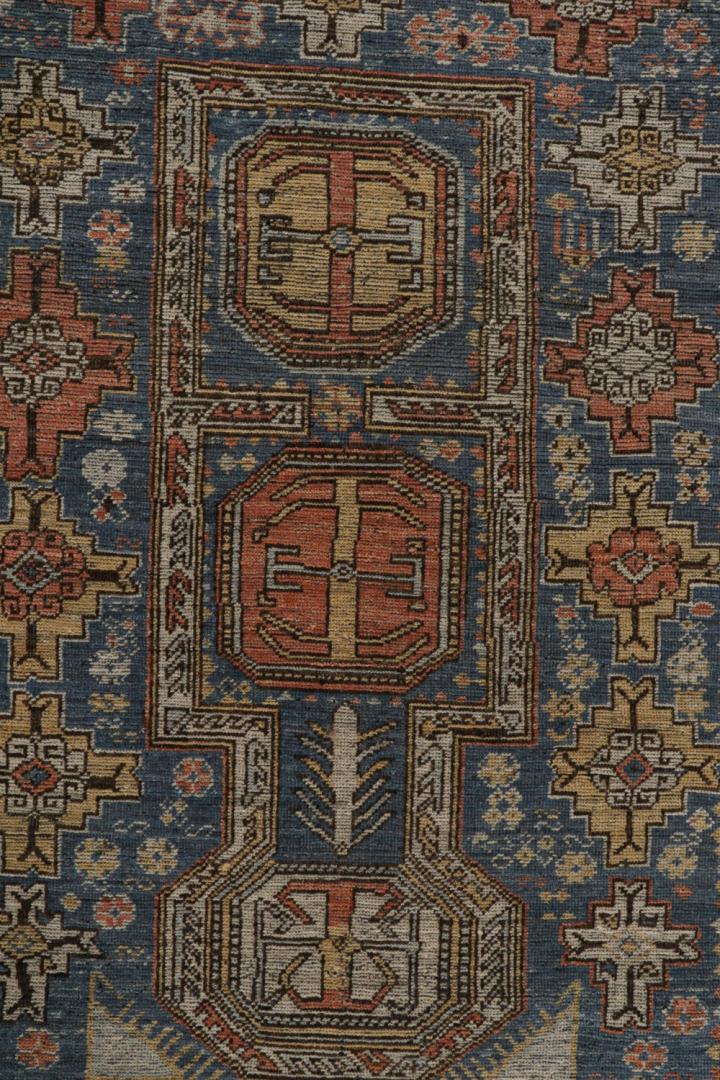 Blue Tribal Rug with Geometric Patterns