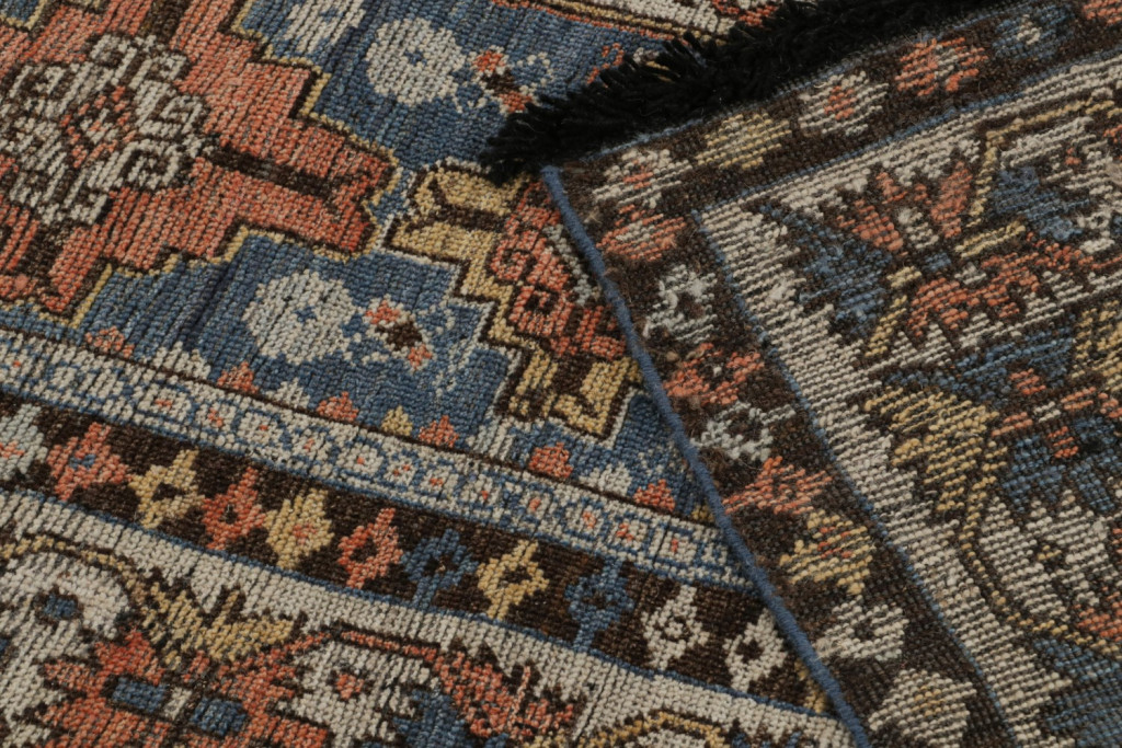 Blue Tribal Rug with Geometric Patterns