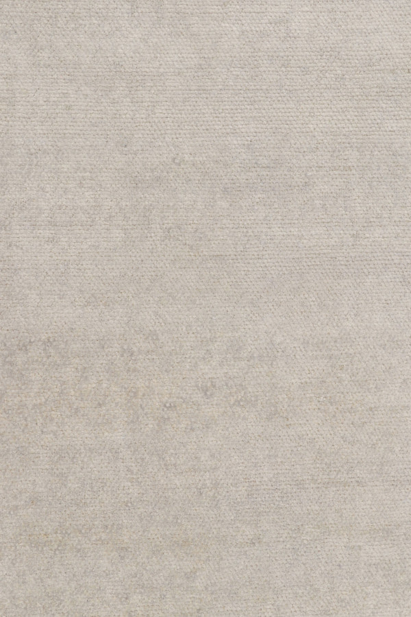 Rug & Kilim’s Oversized Contemporary Textural Solid Rug in Ivory Tones