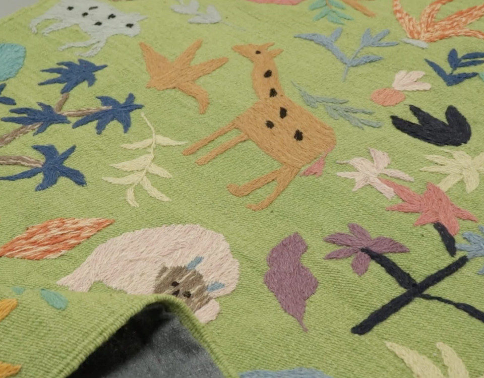 Rug & Kilim’s Suzani Kilim Runner, Vibrant Animal Pictorials in Green >>